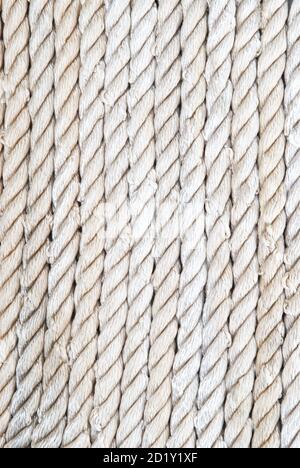 Closeup of strong string white ropes on background sea and deck. Abstract  sailor marine backdrop. Textured twisted vertically fiber line Stock Photo  - Alamy
