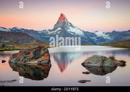 Matterhorn, Swiss Alps. Landscape image of Swiss Alps with Stellisee and Matterhorn in the background during sunrise. Stock Photo