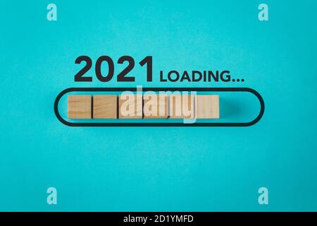 Loading new year 2021 with wood cube in progress bar. Stock Photo