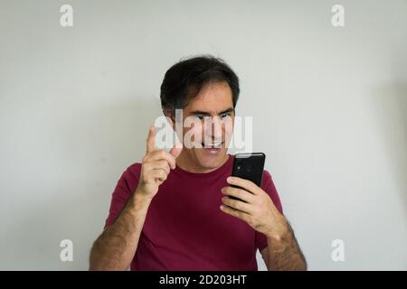 Man speaking using video call on smartphone. Stock Photo