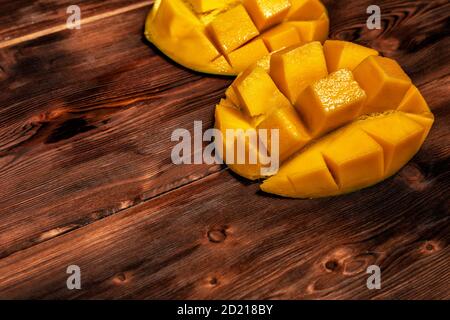 mango on a dark wood background. selective focus on the mangos slices Stock Photo