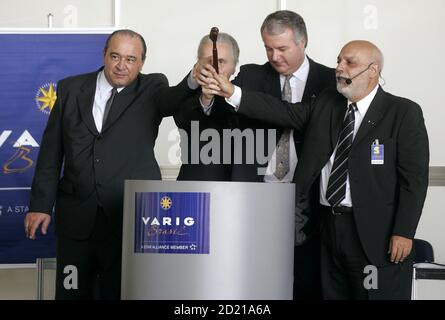 Luis Alberto Fiorri L Partner Of Consultant Group Deloitte Joao Luis Bernardes 2nd L President Of The Varig Log Company Marcelo Bottini 2nd R Chief Executive Of Varig And Carlos Barros Auctioneer Strike The Hammer During The Auction Of Brazilian