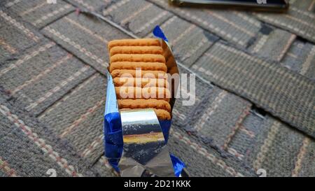 28 September 2020 : Reengus, Jaipur, India : Patanjaly biscuits isolated on fabric cot . Stock Photo
