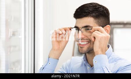 Portrait of smiling young man wearing spectacles Stock Photo