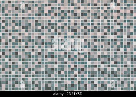 The texture mosaic, moss green on the wall. Tiled background. White, marsh and green abstract mosaic ornament. Stock Photo