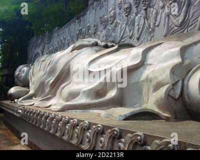 Country Vietnam, sleeping Buddha. Long Son Pagoda on mount Trai Thuy in city Nha Trang. The monument of reclining Buddha. Stock Photo