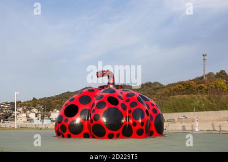 Red pumpkin by Yayoi Kusama on Naoshima, Japan. Stock Photo