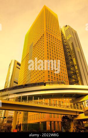 Skyline of skyscrapers at Shiodome Area in Shimbashi district with elevated train, Tokyo, Kanto Region, Honshu, Japan Stock Photo