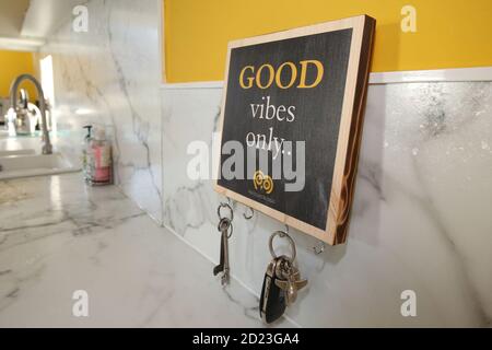 Motivational statements printed onto old wooden floorboard for coastes,  hanging boards for a charity Whiteleys Retreat. Known as flairboards.  Flairboards is an Scottish company that produces inspirational quotes,  expressions and lyrics on