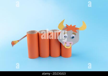 toilet paper roll craft concept, how to make a bull or cow, step by step instruction, simple activity for kids, pencil holder handmade gift for year of ox Stock Photo