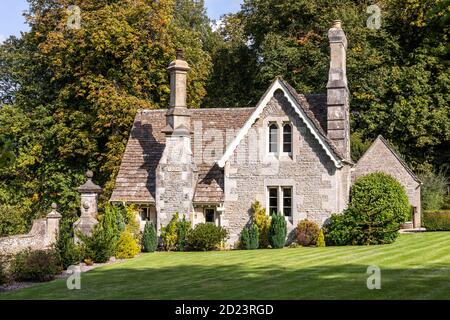 19th century (1864) lodge and gateway to Miserden Park in the Cotswold village of Miserden, Gloucestershire UK