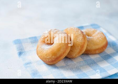 Homemade classic donuts on a light background. Breakfast concept. Copy space Stock Photo