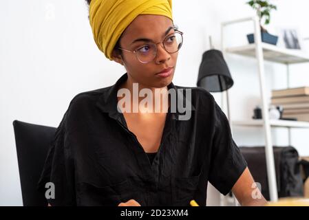 Shot of young latin woman working at home office Stock Photo