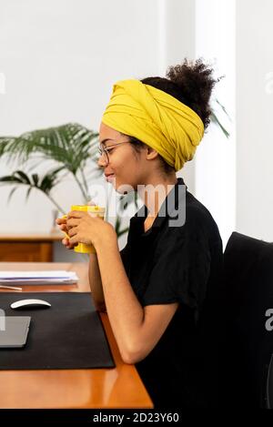 Shot of young latin woman working at home office Stock Photo