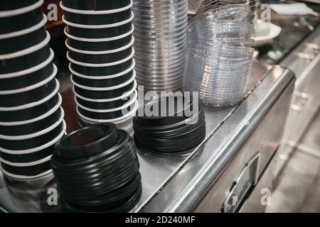 Lots of paper coffee cups and caps at canteen Stock Photo