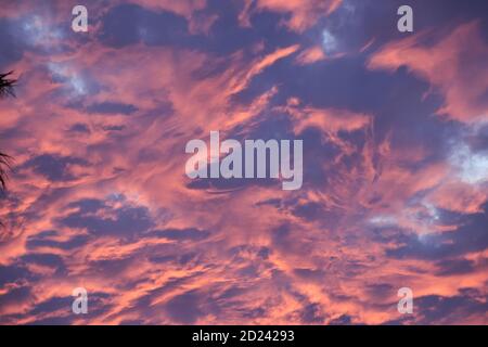 Cloudscape fire dancing in the dark stormy sunset sky Stock Photo