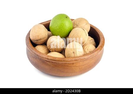 Walnuts in wooden bowl isolated on white background Stock Photo