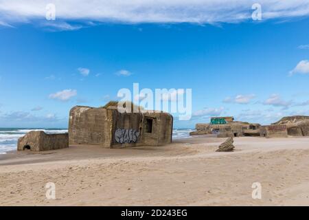Remains of World War II bunkers, part of the Atlantic Wall, at the North sea beach of Løkken, Denmark Stock Photo