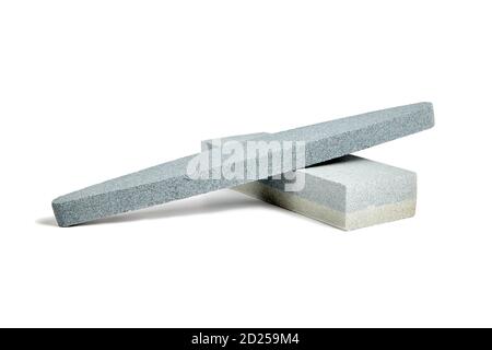 Two Sharpening stones. Grindstone or whetstone sharpener, isolated on white background. Kitchen utensils Stock Photo