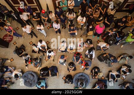 Bangkok, Thailand. 06th Oct, 2020. Visitors seen listening to the guide (not pictured) during the exhibition. Thammasat University assembled an exhibition to commemorate the 44th anniversary of the Thammasat University Massacre that occurred on October 06, 1976 in Bangkok. Credit: SOPA Images Limited/Alamy Live News Stock Photo