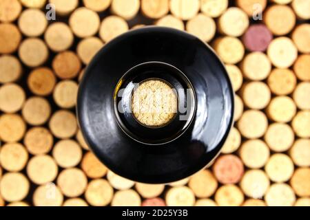 corked glass bottle of red wine, top view. Background pattern of used bottles corks Stock Photo