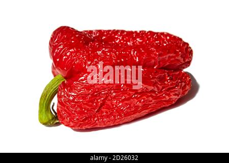 Spoiled wrinkled red pepper isolated on white background Stock Photo