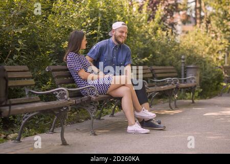 Happy young couple enjoys spring day in park. Stock Photo