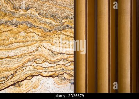 Detail of the folding door by the ornamental natural texture wall Stock Photo