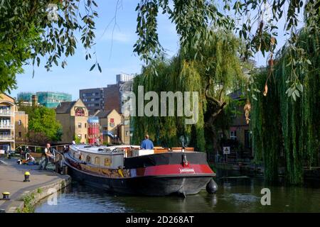 UK, London, Canal barge at the Kentish Town Lock, a lock gate on the Regents Canal, public footpath, summer, urban skyline, tranquil scene Stock Photo