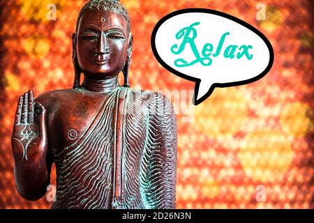 Buddah Sculpture and a Speech Bubble with the Word Relax Stock Photo