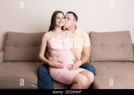 Premium Photo  Loving husband gently hugging his pregnant wife. happy  family in anticipation of the birth of the baby.