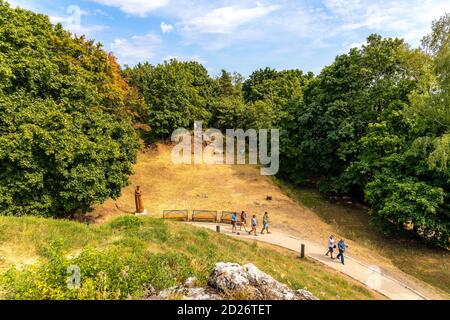 Checiny, Swietokrzyskie / Poland - 2020/08/16: Eastern slopes of Checiny Royal Castle hill - Zamek Krolewski w Checinach - medieval stone fortress in Stock Photo