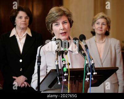 U.S. first lady Laura Bush (C) accompanied by Sens. Dianne Feinstein (D-CA) (L) and Kay Bailey Hutchison (R-TX) speaks during a joint news conference by the Senate Women's Caucus on Burma on Capitol Hill in Washington May 23, 2007. REUTERS/Yuri Gripas (UNITED STATES)