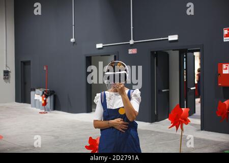 Trieste, Italy - September, 06: Woman wearing virtual reality headset during the ESOF, Euroscience open forum in Trieste on September 06, 2020 Stock Photo
