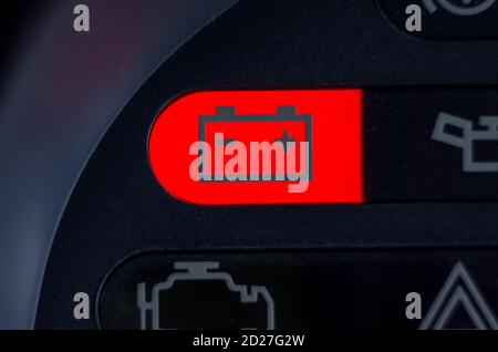 Screen symbols battery warning light in-car dashboard, close up Stock Photo