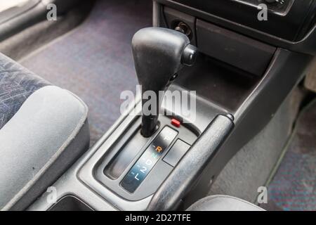 Automatic gearbox in the car on a gray background for movement and acceleration. Abstract image of fast speed. Warranty and recall of the transfer fro Stock Photo