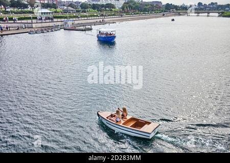 Two younger women in a hire motor boat at Southport Stock Photo