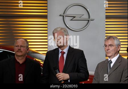 Opel Chief Executive Hans Demant C State Premier Of Hesse Roland Koch L And Opel Chairman Of The Board Carl Peter Forster Talk At The Production Site Of German Car Manufacturer In Ruesselsheim September