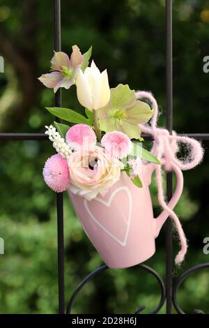 romantic bouquet of white and pink spring flowers in cup Stock Photo