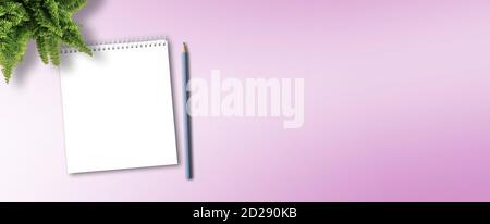 blank spiral notepad and pencil for taking notes on pink desk background Stock Photo