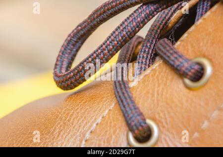 Close-up of laces on brown leather shoes, background Stock Photo