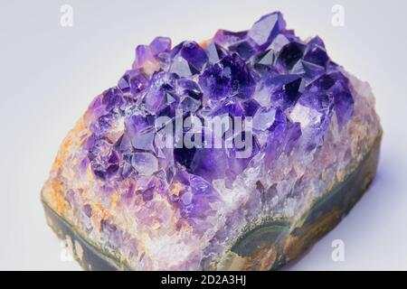 violet amethyst gemstone on white background, color photo Stock Photo