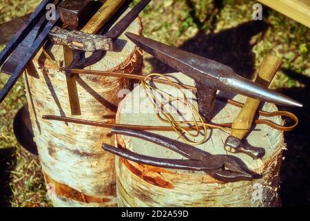 Vintage blacksmith tools. Hand-made antique tool for blacksmithing. Stock Photo