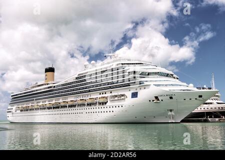 La Romana, Dominican Republic - February 16, 2016: luxury yachts docked in the port in bay at sunny day with clouds on blue sky in La Romana, Dominican Republic Stock Photo