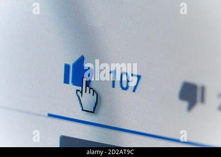 Mogilev, Belarus - March 22 2020: Cursor on the Thumbs up button close-up on the monitor screen, background Stock Photo