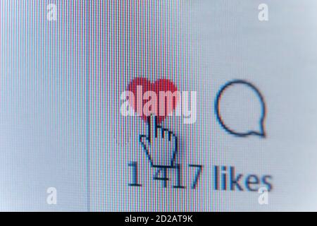 Mogilev, Belarus - March 22 2020: Cursor on the Like button on the monitor screen, background Stock Photo