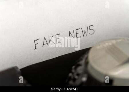 Close up printed text Fake news on an old typewriter Stock Photo