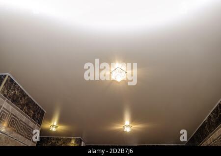 Stretch ceiling in the bathroom with three spotlights Stock Photo