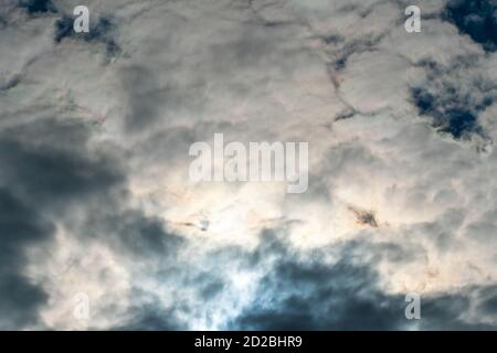 Sky with dark clouds and sun, beautiful background Stock Photo