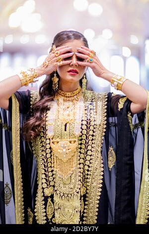 Arab Female in traditional dress with traditional jewelry Stock Photo